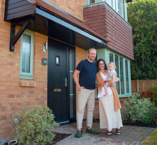 Bellway family in front of their home